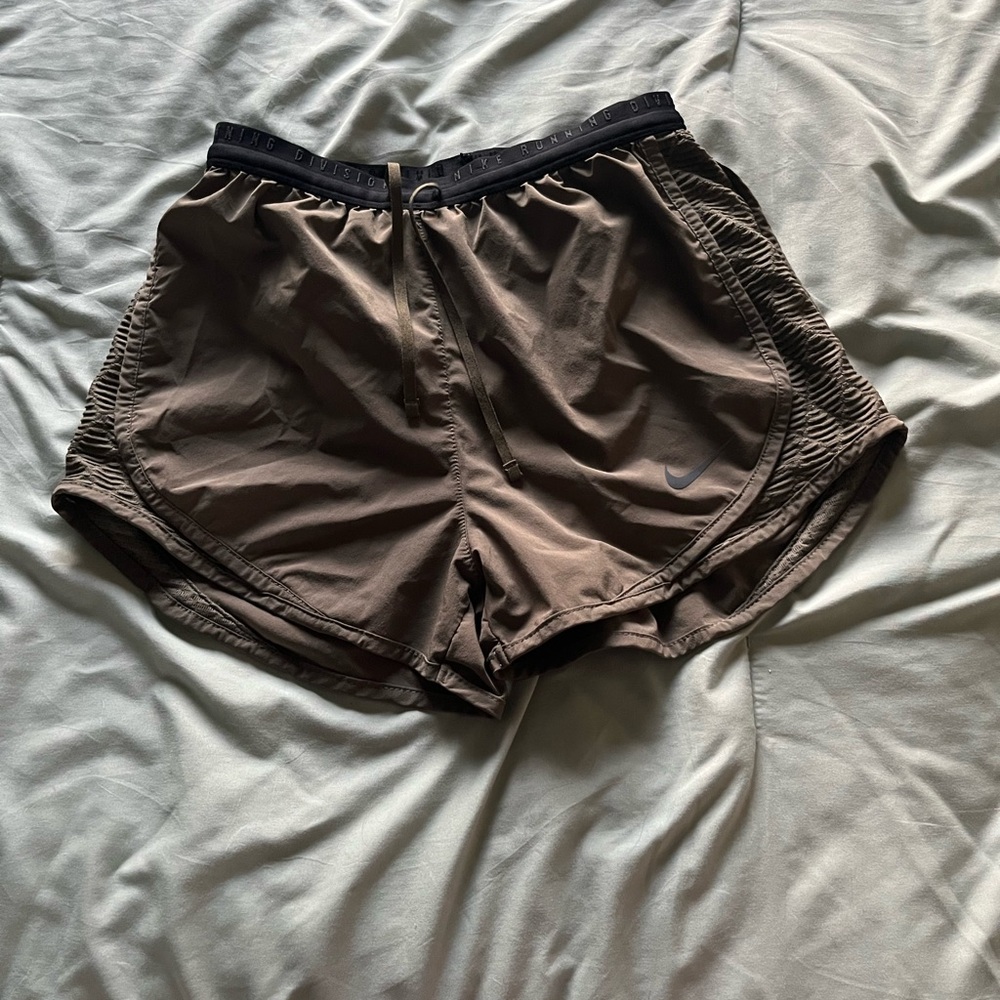 Girls green Nike running shorts